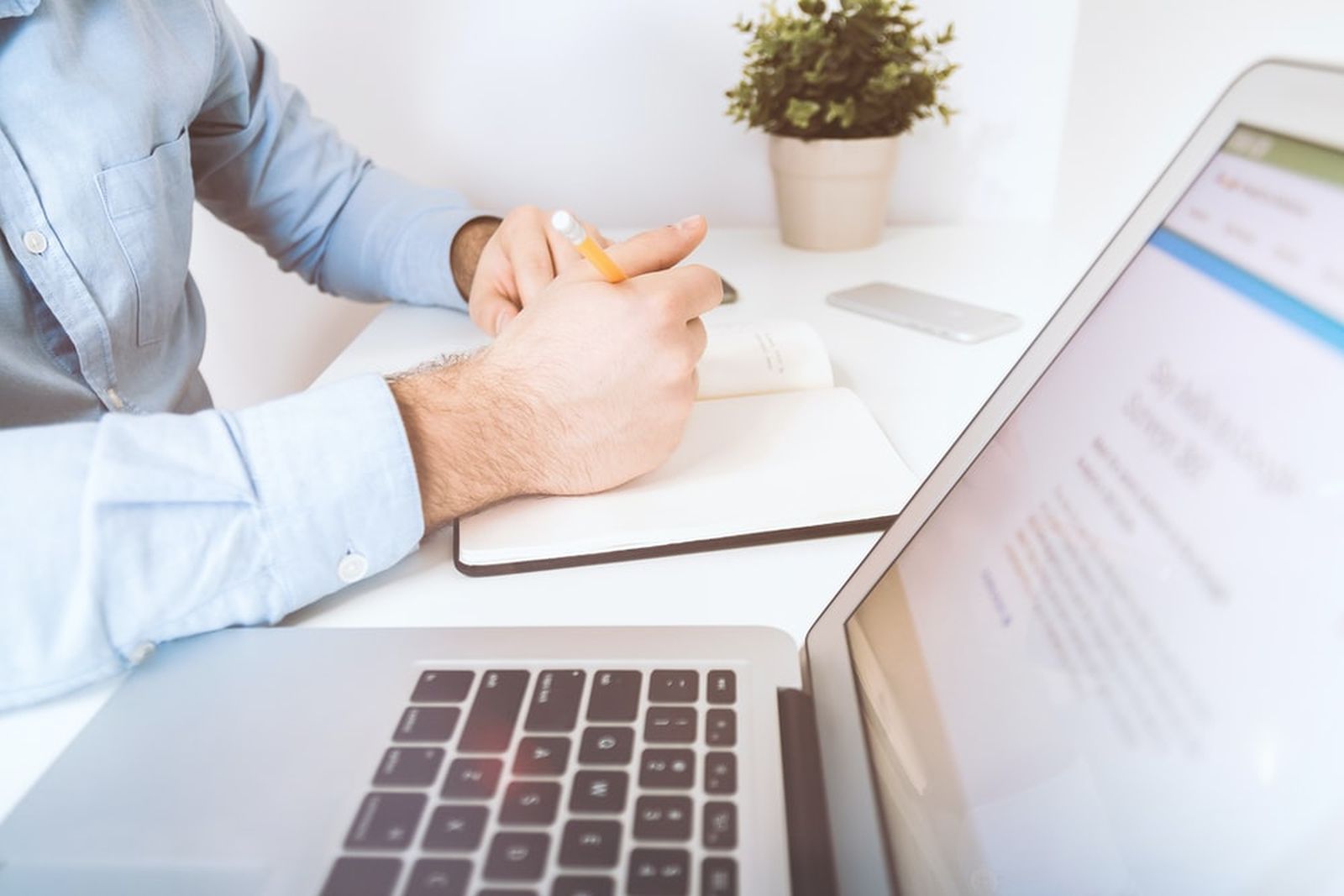 Man working on crm for insurance on his laptop