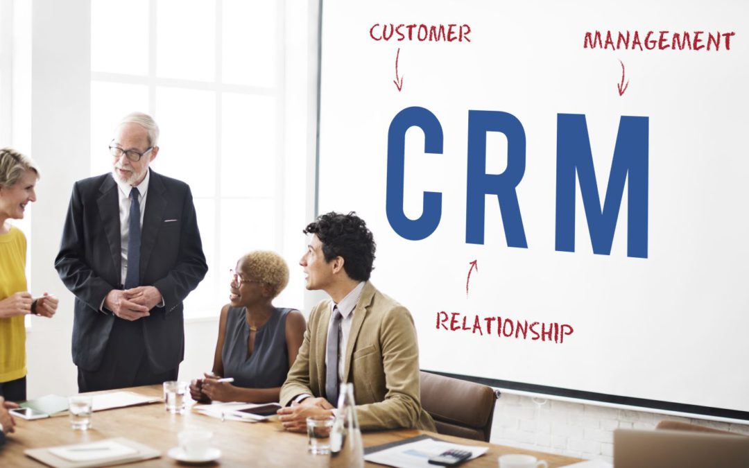 Four people are discussing about crm in real estate
