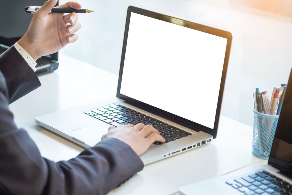 Man working on laptop for salesforce